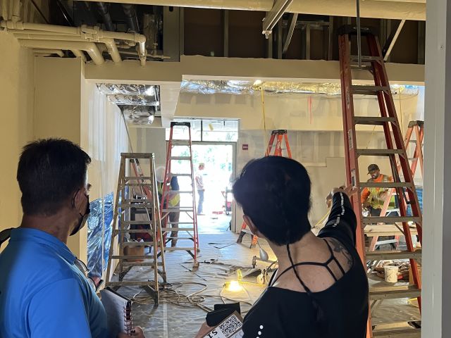 Microscope room Dorit shows technician where things will go