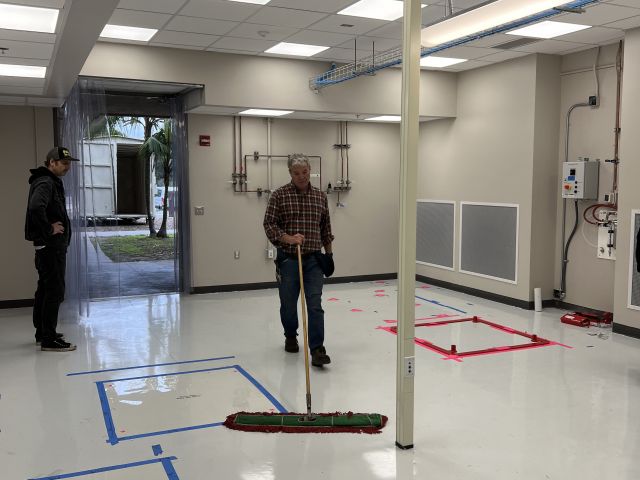 Final clean of floors before bringing boxes in