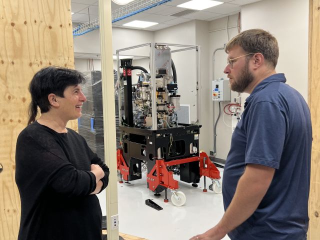 Dorit and installation engineer Shawn discuss logistics