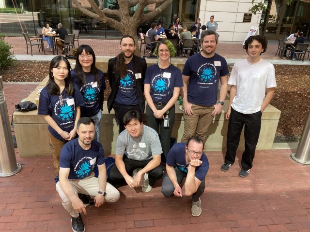 Group of Hanein Lab symposium attendees wearing matching shirts from previous year