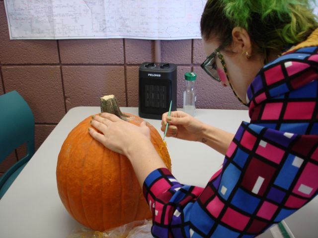 Carving our pumpkin with a scalpel